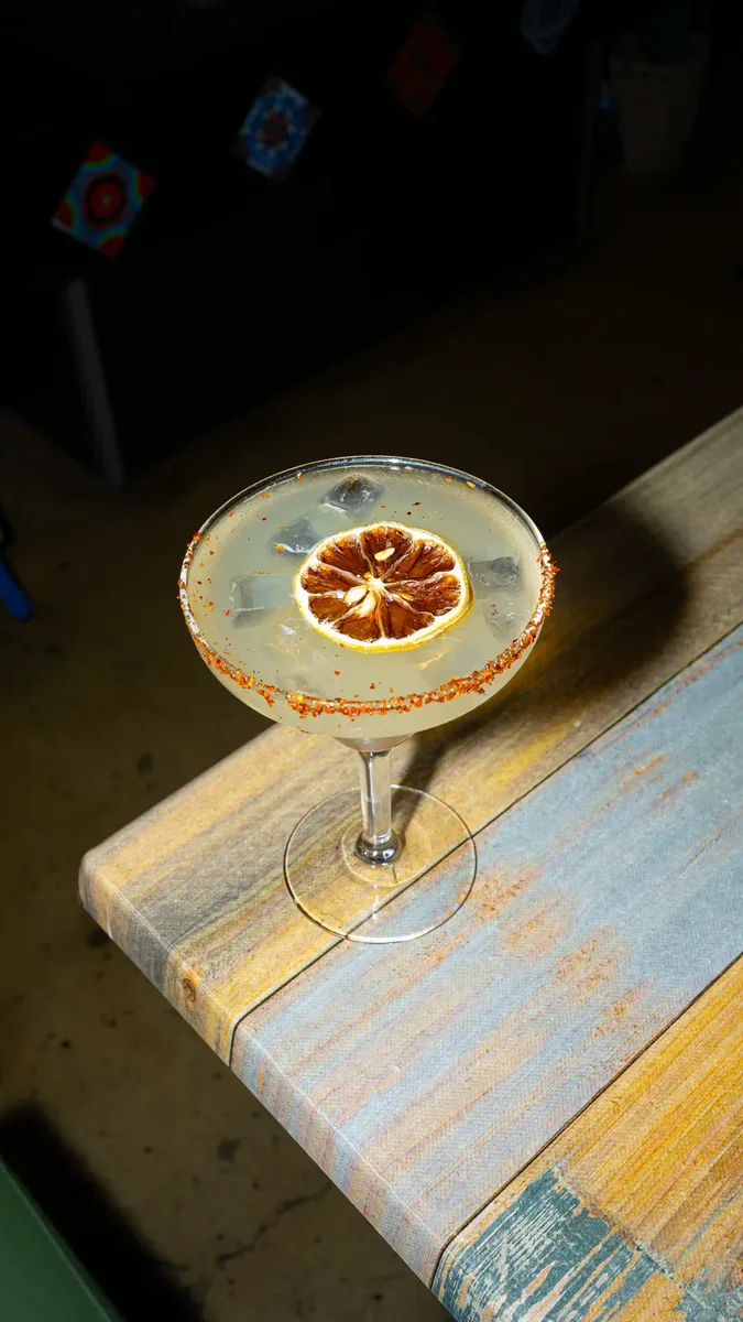 Frozen margarita on the bar edge